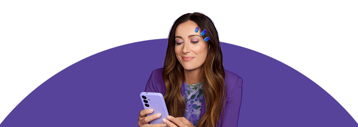 Woman in purple holding eye drops