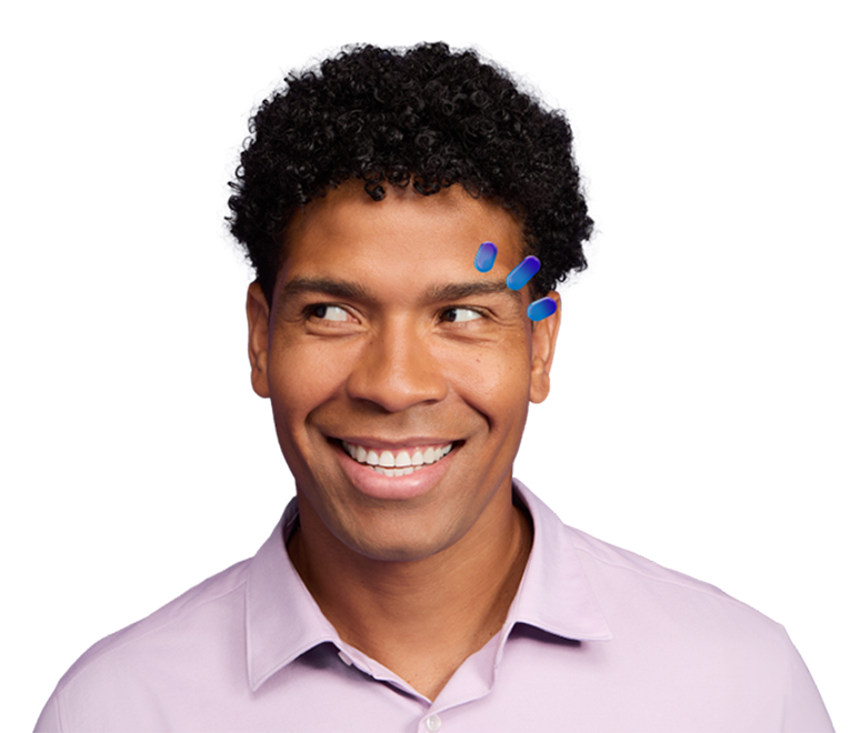 Man looking to the left with three drops next to his eye