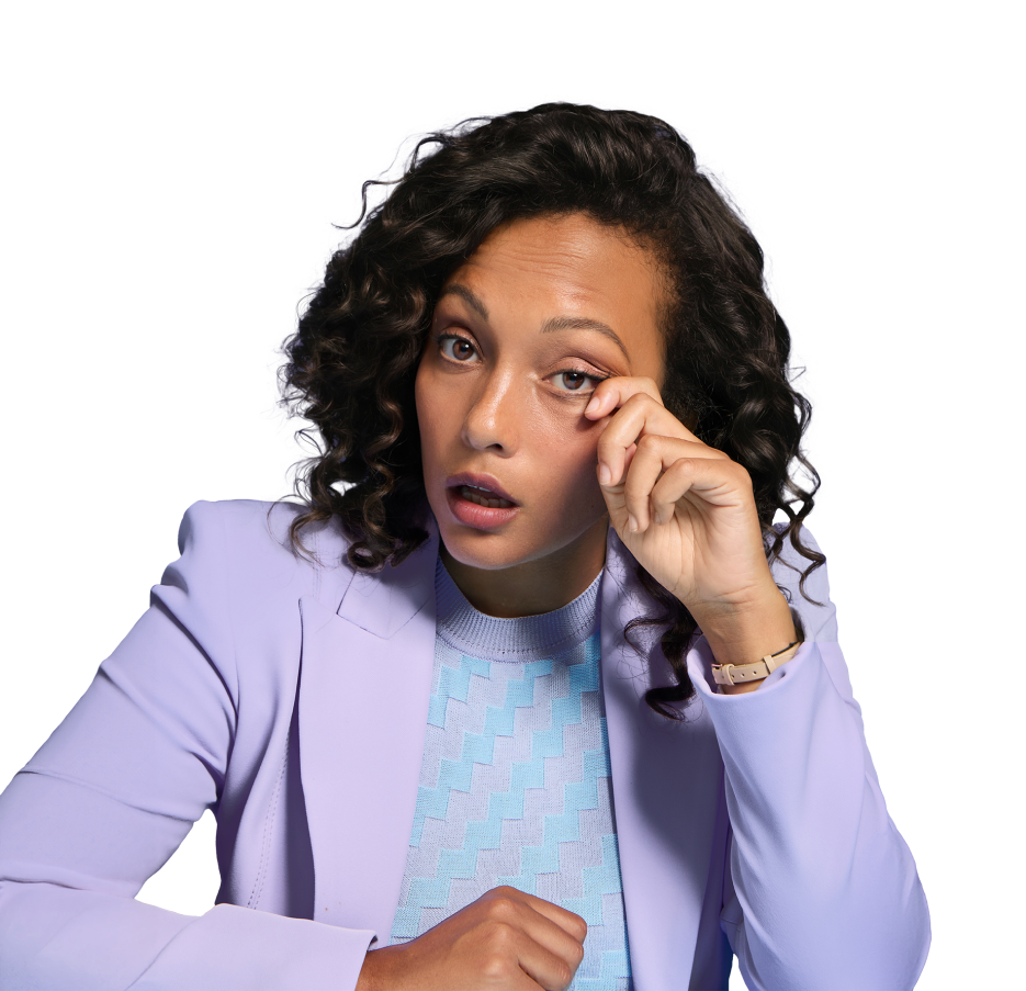 Woman in purple rubbing her eye